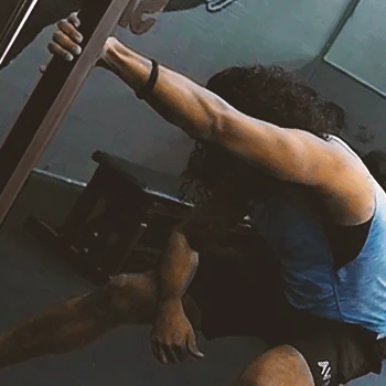A person doing Unilateral Fixed Bar Lat Stretch workouts