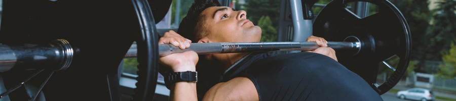 A person in the gym doing Jeff Nippard push workout in the gym