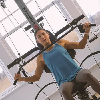 A person working out on the Bowflex Xtreme 2 SE home gym