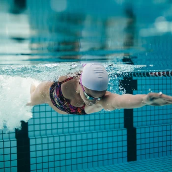 Woman swimming under water