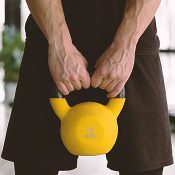 A person doing explosive kettlebell workouts in the gym