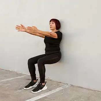 a picture of a person doing a wall sits