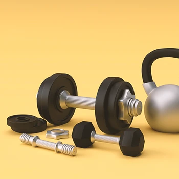 Close up shot of dumbbell weights and a kettlebell