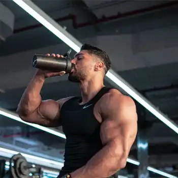 a photo of Andrei Deiu taking protein drink