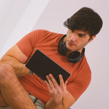 A person looking up reviews online on a tablet