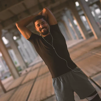 A person stretching outside for cardio