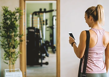 A person looking at her small home gym