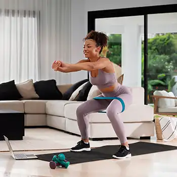 an image of a woman doing exercise to firm her glutes