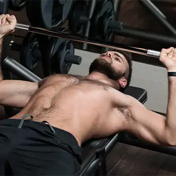 a picture of man doing chest workout