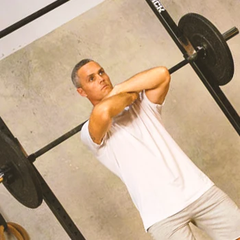 A person doing crossed arm squats