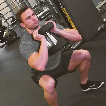 A person doing a dumbbell goblet squat