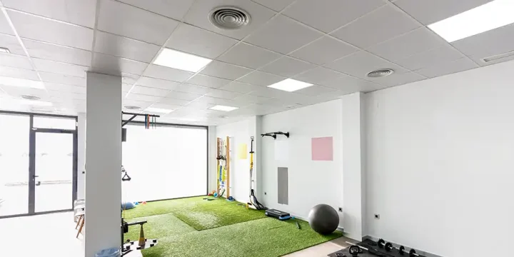 an image of a home gym under white ceiling