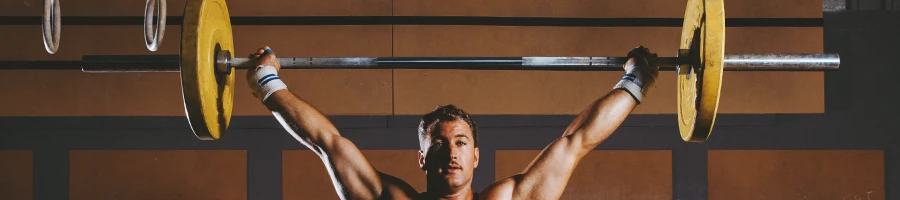 A person showing how to overhead press