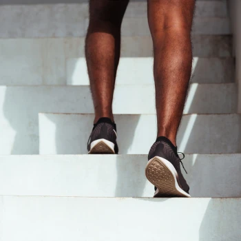 Man doing a leg workout on stairs