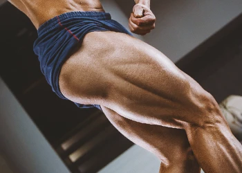 Close up shot of quad muscles of a person