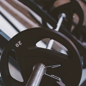 Close up shot of a barbell on a rack