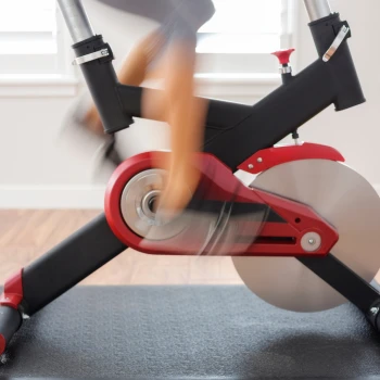 Person riding home exercise bike