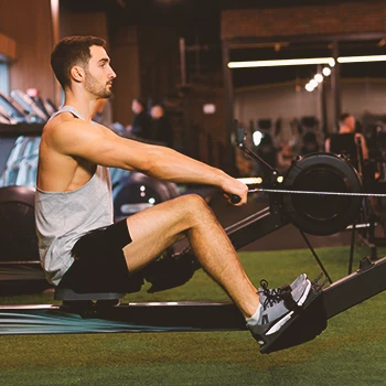 A person working out on a Rower