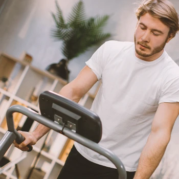 A person on a treadmill at a home gym