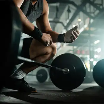 a picture of person preparing for lifting the barbell