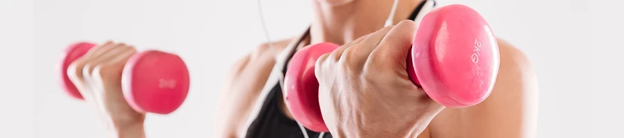 A woman using dumbbells for her workout