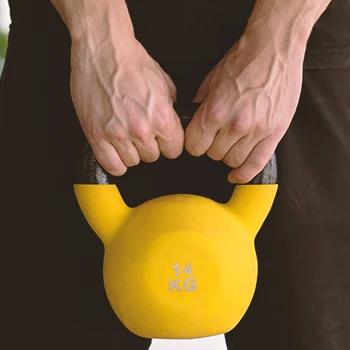 A person conditioning his body with a kettlebell