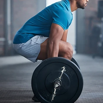 A man who is about to lift the barbell