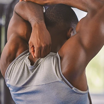 A person doing behind head tricep stretches