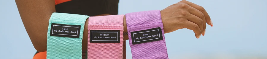 A person holding resistance bands