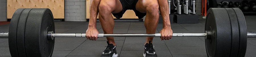 A man doing deadlifts as hip strengthening exercise