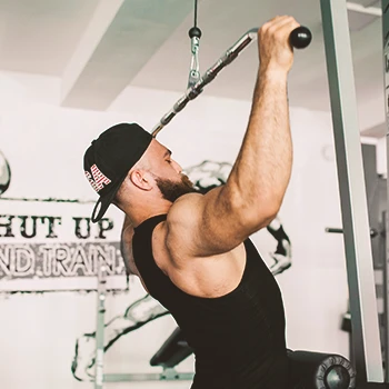 A person doing chest to bar lat pulldowns at the gym