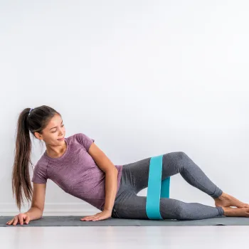 Woman doing a clamshell exercise