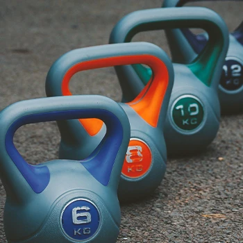 Close up shot of a row of kettlebells