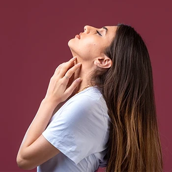 A woman doing neck exercises