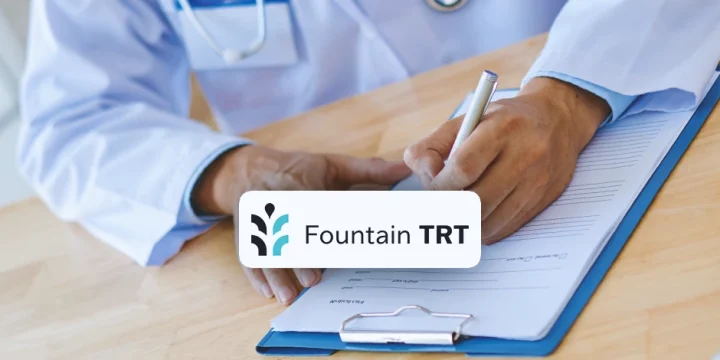 A doctor writing down on a clipboard with Fountain TRT logo