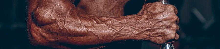 A close up shot of a muscular man's veins