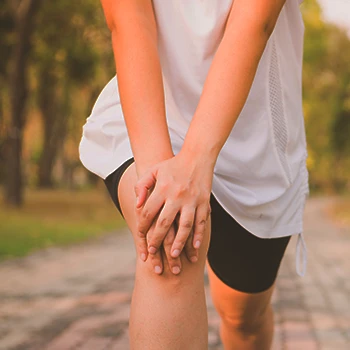 A person stretching their joints outside