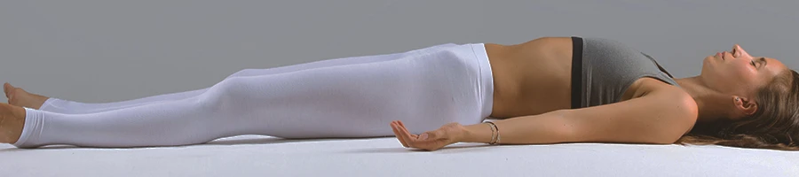 A woman doing recovery on the floor