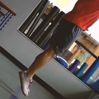 A person doing jumping calf press workouts at the gym