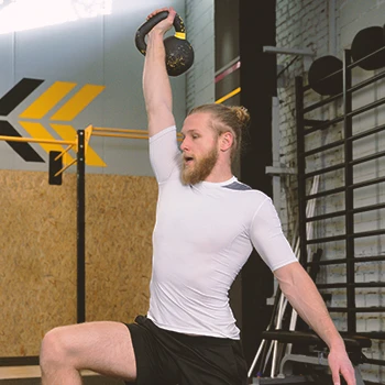 A person doing kettlebell snatch workouts