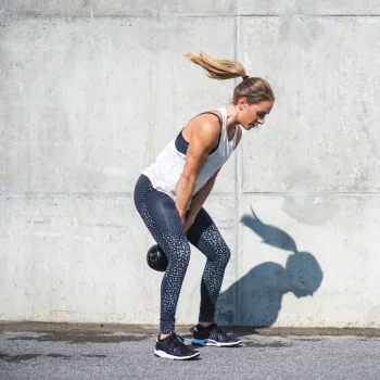 Person doing HIIT Kettlebell swings