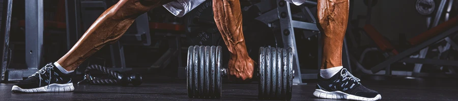 A person at the gym preparing to do Kroc Rows