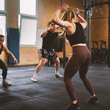 A group of people doing burpees