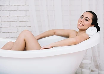 A woman adopting the Hunter reaction in her ice bath