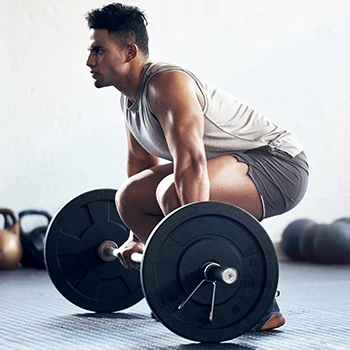 A man in the gym doing deadlifts