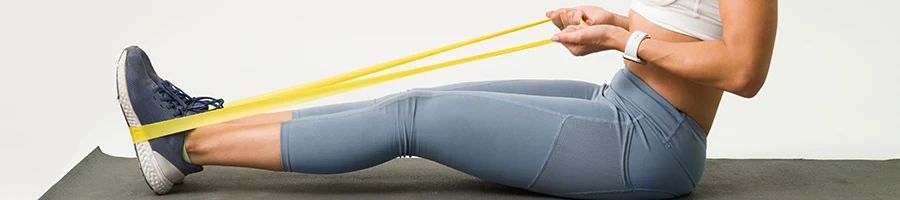 A woman doing her exercise using a resistance band