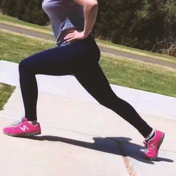 A person doing plyo lunges outside