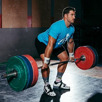 A man doing the proper form in doing the Romanian deadlift