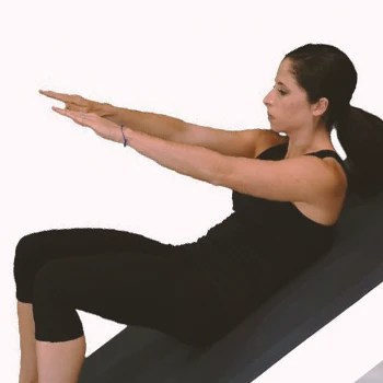 A woman doing the reach and crunch