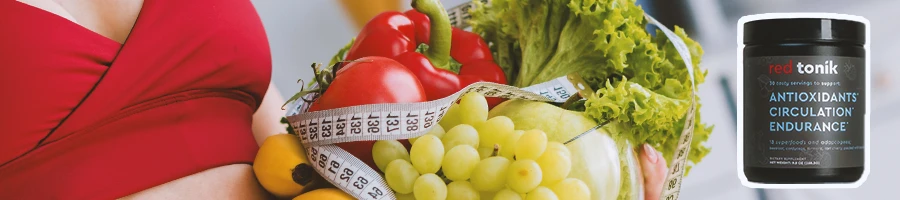 Close up shot of healthy ingredients with Red Tonik on the side